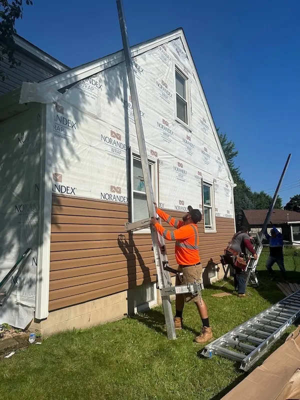 Saints Exteriors siding job in progress