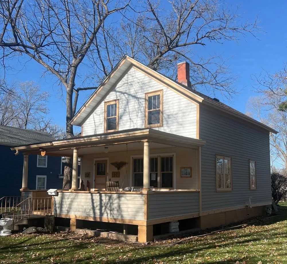 Completed residential siding replacement on a two-story home